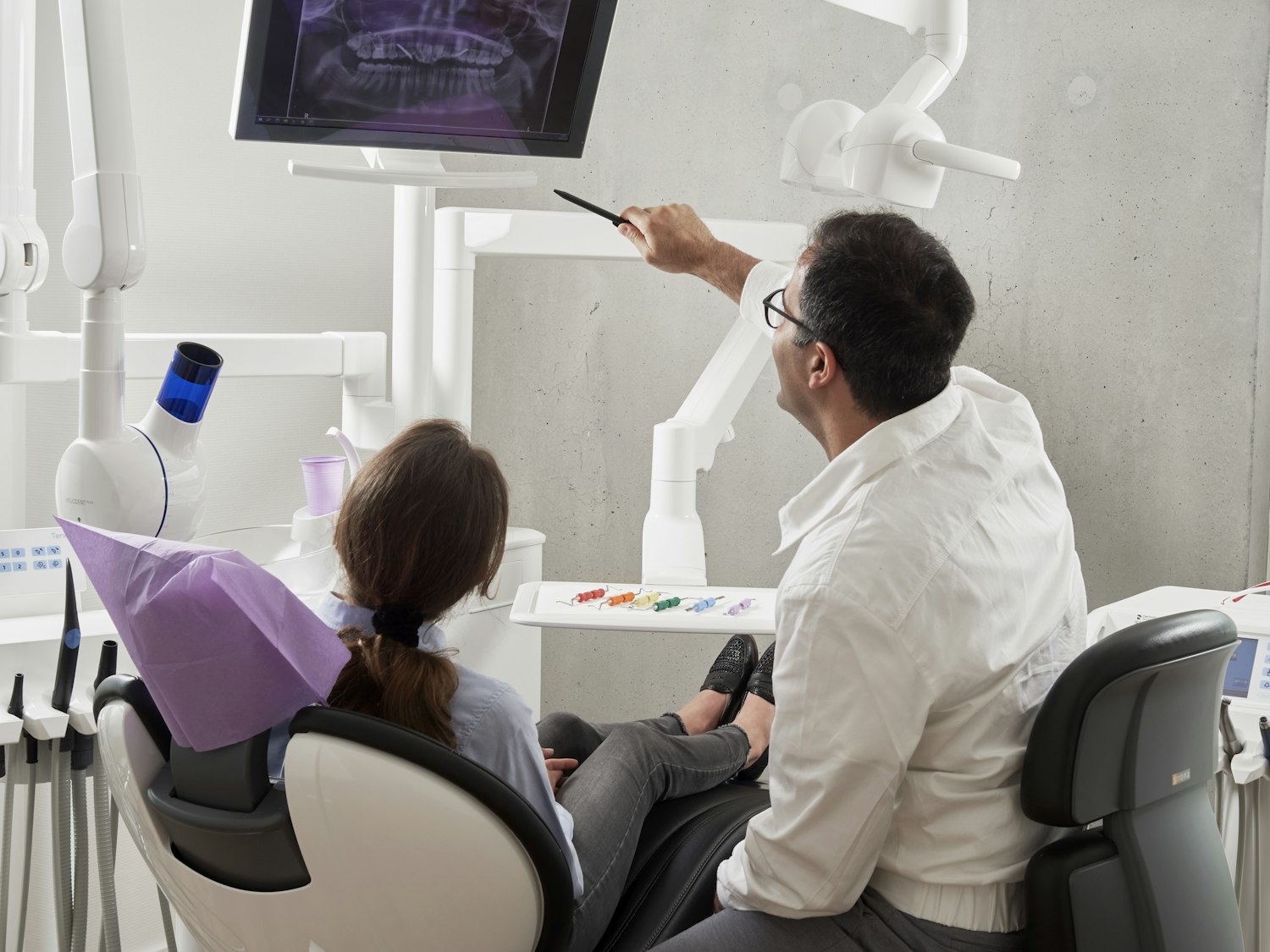 A Beard Family Dentistry dentist reviewing X-rays with a patient