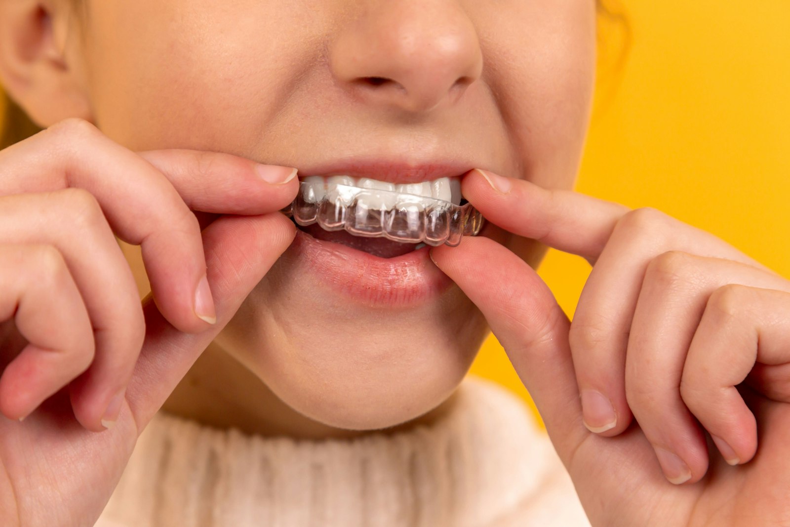 A patient admiring her healthy, confident smile